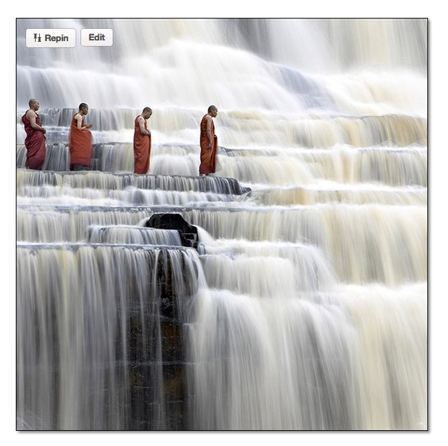 monks at waterfall