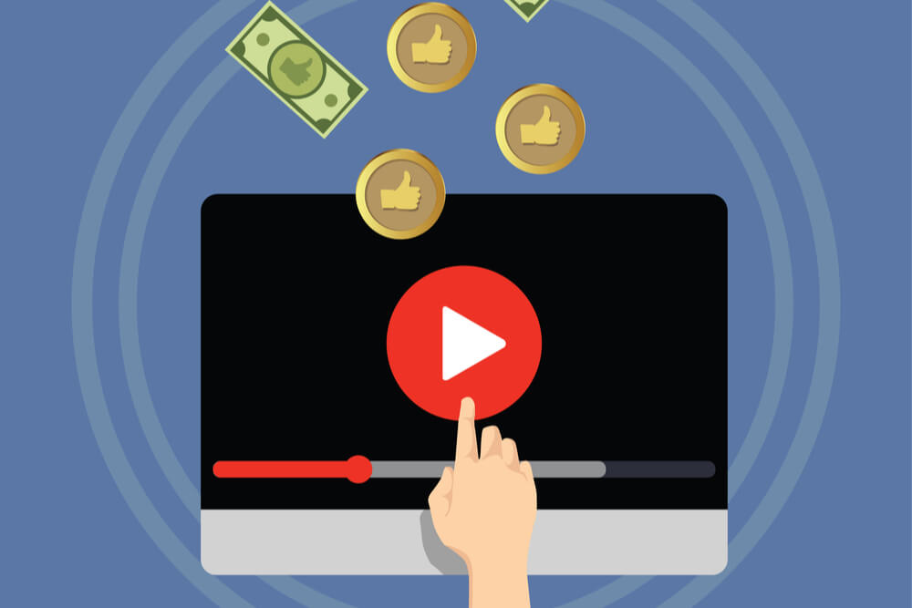 ilustraçao de computador com simbolo da plataforma youtube ao meio e moedas em sua volta