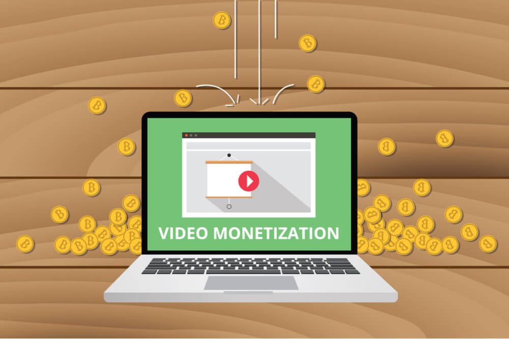 ilustraçao representano laptop em video do site youtube com a frase video monetization e moedas ao fundo