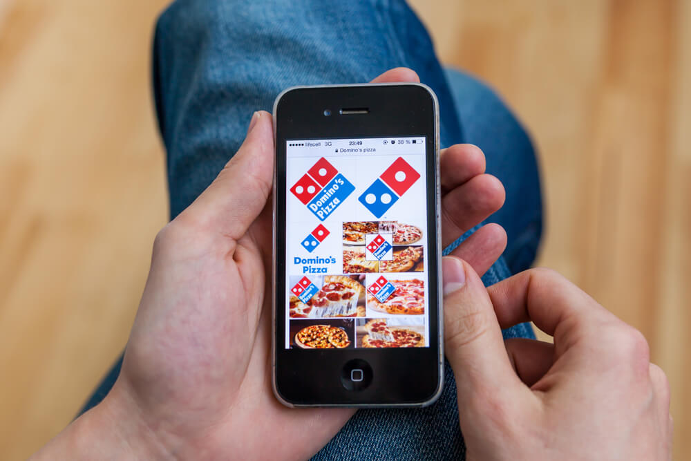 imagens da empresa Domino's pizza como exemplo de empresa que utiliza sorteios no instagram